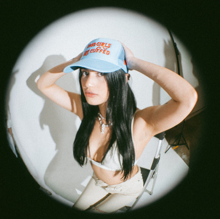 GOOD GIRLS ARE CUFFED TRUCKER - LIGHT BLUE/ RED